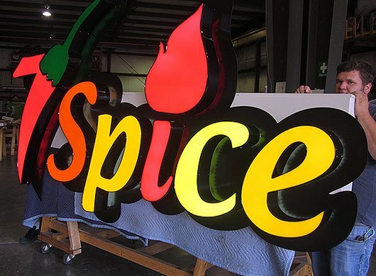 Photo of 7-spice front/back lit sign